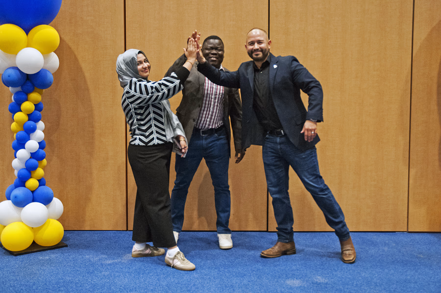 Fidel high-fiving a group of students after his “From chaos to completion” training and Northeastern Illinois University NATT day.