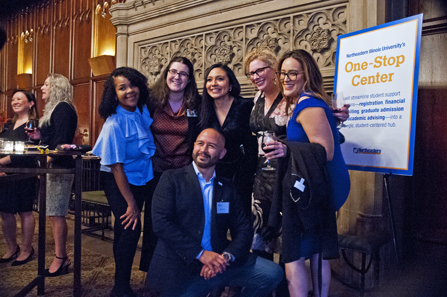 Fidel posing with a group of NEIU supporters at the Northeastern Illinois University Foundation event.